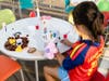 An attendee takes part in an arts and crafts activity during the AutoNation Family Fun Day. 