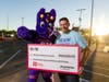 The WNBA Phoenix Mercury mascot joins Victor Tanori, General Manager of AutoNation Chrysler Dodge Jeep RAM North Phoenix, at the AutoNation Family Fun Day.