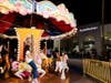 Children take a spin on the carousel during the AutoNation Family Fun Day. 