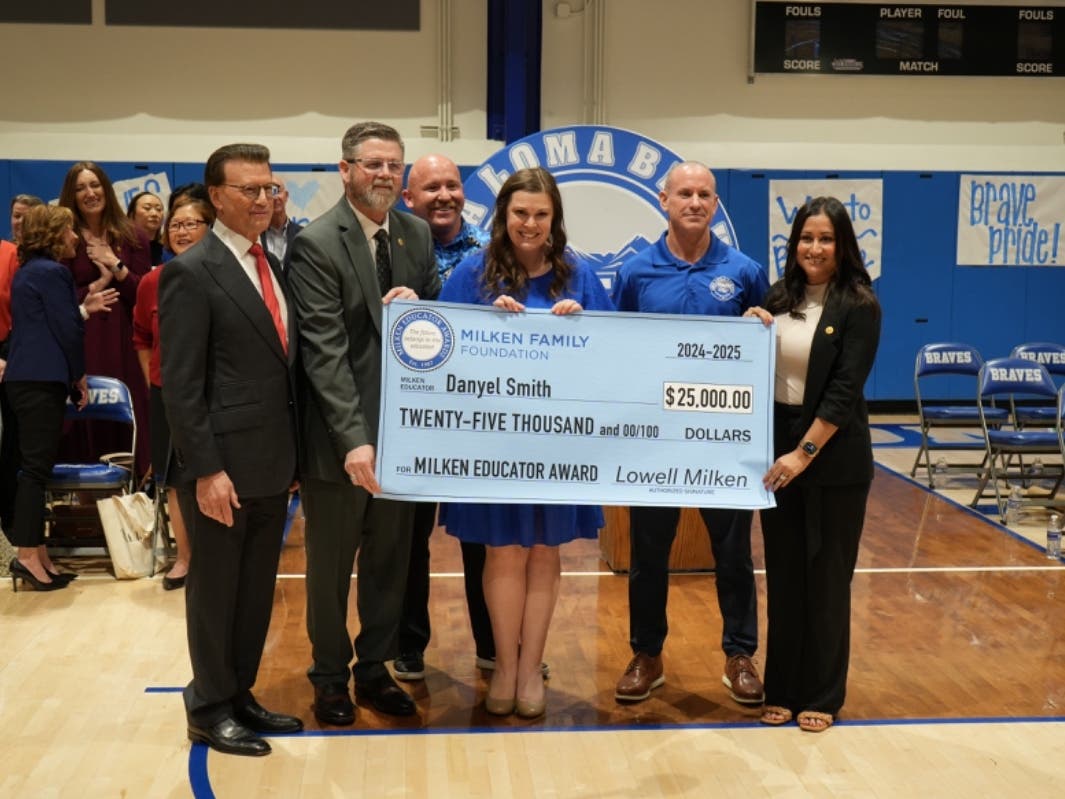  From left: Lowell Milken; past winner Kirk Brown; Alta Loma High School Principal Jason Kaylor; recipient Danyel Smith; Chaffey Joint Union High School District Superintendent Dr. Mathew Holton; and past winner Alexis Arias