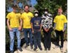 Helping Hands volunteers Peter Brooks, Jaim Nonenmacher, and Joseph Brooks with Betty Wynn-Ellis and her son. 