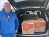 Dan Davin of the Pearl River American Legion delivering a holiday food package from the GAA