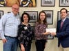 Bridgette Garnache is presented a scholarship by Dr. Ronald Severino, CDH medical staff president