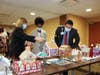 Trish Heerlein, Vice President of Operations; Leah Hobson, CFO; and Jeff Good, President, take a closer look at over 30 gingerbread houses created by staff at Northwestern Medicine Palos Hospital