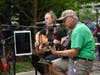ICU Nurse Katie Ragona, RN, and Jeffrey Huml, MD, medical director of Critical Care Medicine, perform a duet at an outdoor concert at Central DuPage Hospital