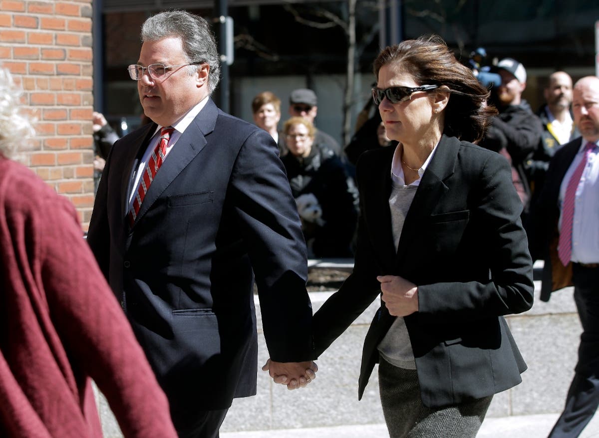 Manuel and Elizabeth Henriquez arrive at federal court in Boston on April 3, 2019.
