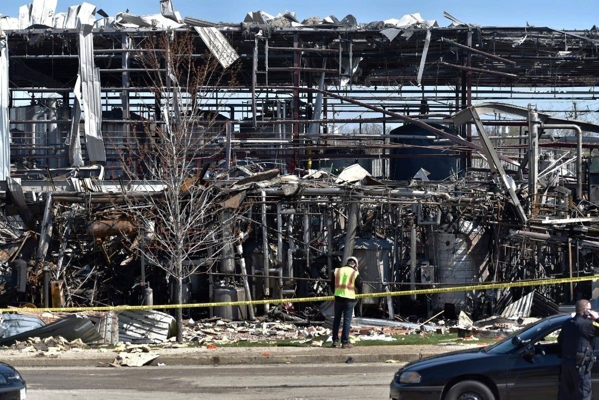 Emergency personnel work at the scene of an explosion at AB Specialty Silicones at Sunset and Northwestern avenues.