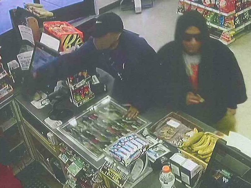 A surveillance image shows two men who police say took part in an armed robbery on June 16, 2019 at a Niles 7-Eleven.