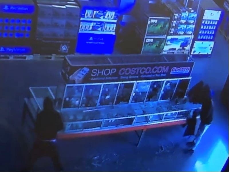 An image captured from surveillance video shows burglars stealing jewelry from the Costco in Mettawa, according to the Lake County sheriff's office.