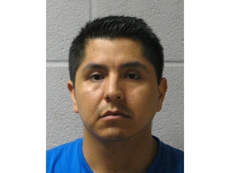 Police said a warrant has been issued for the arrest of David Garcia-Espinal, 40, of Highwood, on charges stemming from the discovery of a hidden camera in the staff bathroom at a local elementary school.