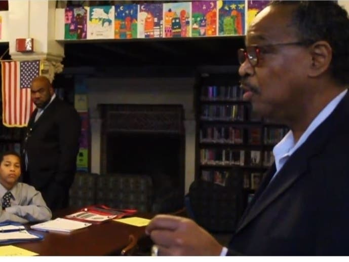 Hecky Powell, who for decades offered scholarships, mentoring and jobs to hundreds of young Evanstonians, is pictured speaking to participants in the Officer and a Gentlemen Academy program in 2018.