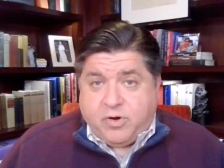 Gov. J.B. Pritzker appeared at a news conference Wednesday from his home, where he said he plans to self-quarantine until Oct. 12 after a member of his staff tested positive for the coronavirus earlier this week. The governor said he has tested negative. 