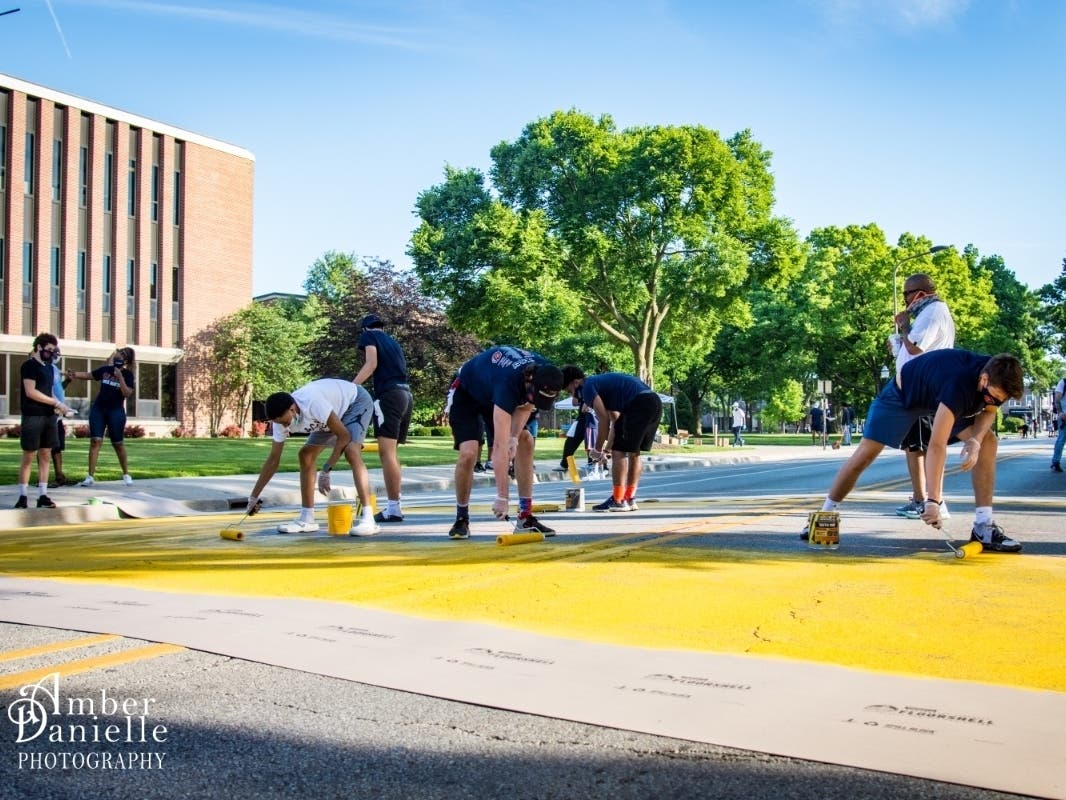 The Evanston Township High School basketball team spearheaded an effort to paint a mural that reads, "Black Lives Matter" on Dodge Avenue in front of the campus.