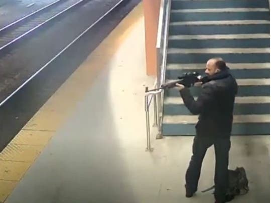 The FBI released Metra security video of a man firing a single shot from a collapsible rifle.