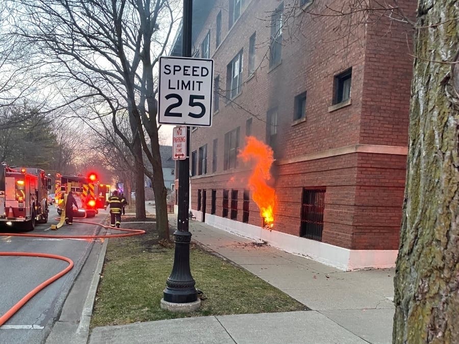 Fire crews are pictured at the scene of a fire in an apartment building in the 1200 block of Judson Avenue.