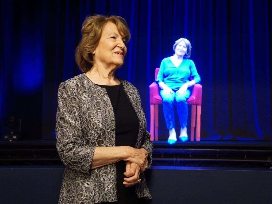 Frieda "Fritzie" Fritzshall, 91, of Buffalo Grove, is pictured with a holographic version of herself created for an interactive survivors experience at the Illinois Holocaust Museum and Education Center.  