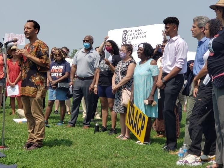 District 65 parent Abdel Shakur, one of about a dozen speakers at Tuesday's rally, said it was time to shut down the "production of white victimhood in our community."