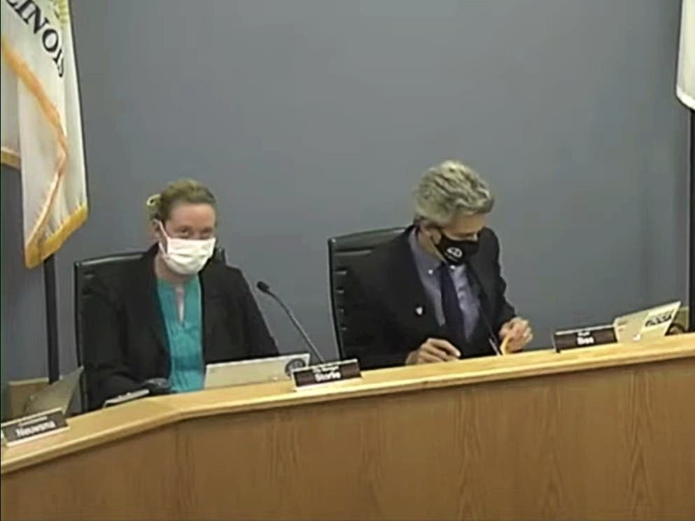 The Evanston City Council delayed a vote on a severance deal that City Manager Erika Storlie, at left, negotiated with Corporation Counsel Nick Cummings before Mayor Daniel Biss, at right, placed it on the agenda and recommended its approval. 