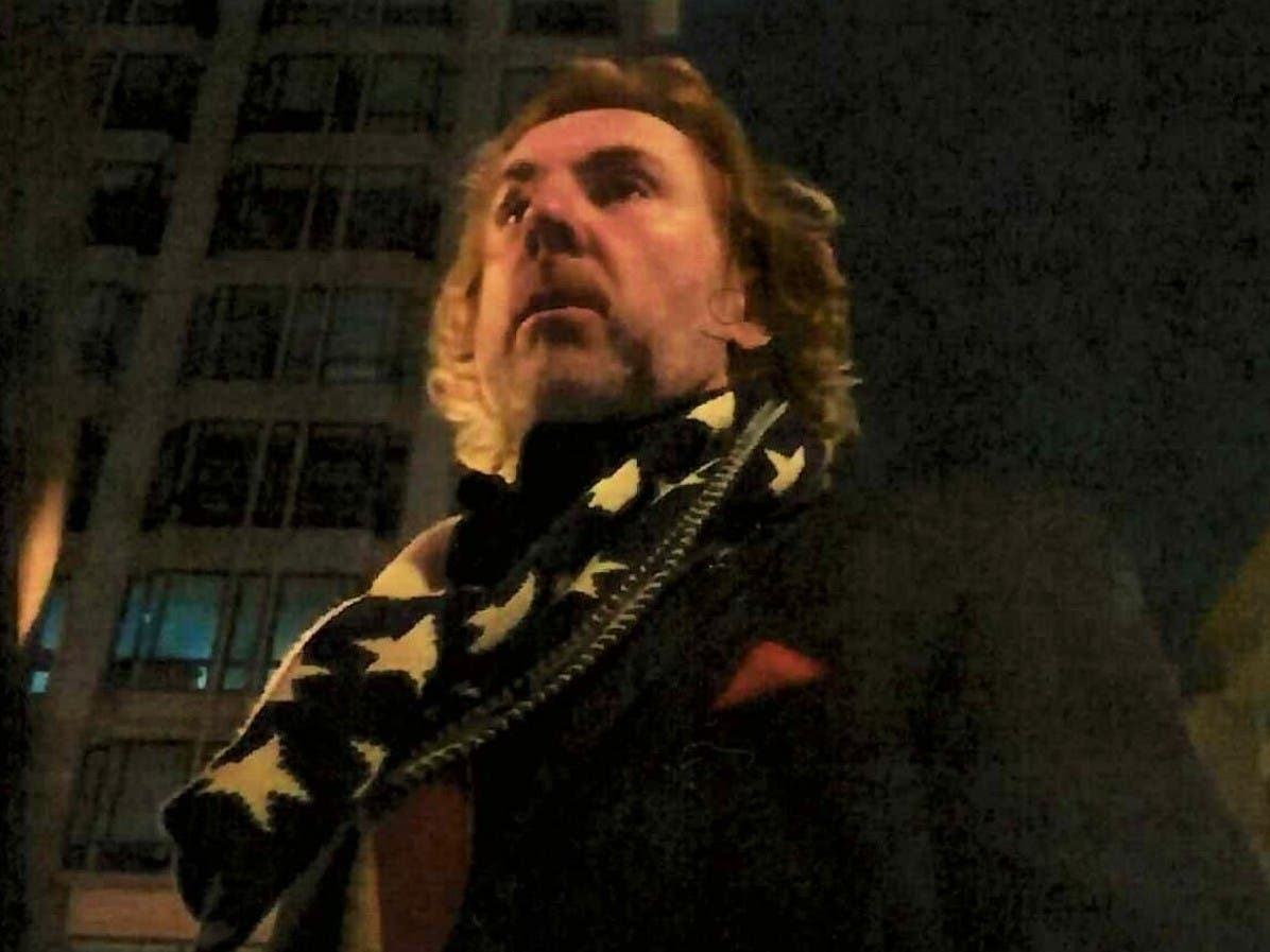 An image captured from a YouTube video streamed on Jan. 5 shows Chicago community activist Larry Ligas in Washington, D.C. ahead of the Capitol riot, according to the FBI.