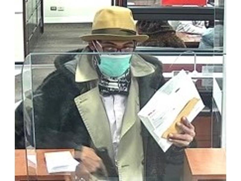 Authorities said this image captured from security video shows an armed man who robbed a bank in Evanston after passing a note to a teller.