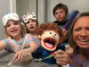 Troy Cronin Elementary School P.E. teacher Tyler Slowinski, at home with her children, films one of her “Jack the Puppet” videos for her students to watch at home.