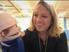 Troy Cronin Elementary School P.E. teacher Tyler Slowinski teaches “Jack the Puppet” how to wear a bicycle helmet.