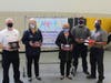 Troy 30-C principals Kelly Landers and Renee Marski, center, helped donate box lunches to the volunteers helping with Covid-19 vaccinations, including Joliet Fire Dep't Deputy Chief Jeff Carey and firefighters Alex Garcia and Asher Cherrington.
