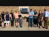 Family of former Troy Cronin Elementary School math teacher Kelly Holmes, along with Cronin staff, including Principal Jill Howard, Assistant Principal Katie Hogan and Superintendent Dr. Todd Koehl, at the dedication ceremony for the memorial bench