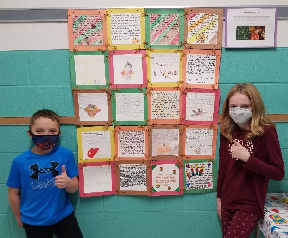 Corey and Abby are two Troy Hofer Elementary School students who made quilt squares of thanks that they “stitched” together to form paper quilts.