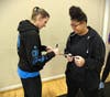 Chicago Sky guard Allie Quigley with Troy Middle School Basketball Team member Mikayla Rivera.