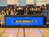 Chicago Sky guard Allie Quigley, center, with the Troy Middle School Girls’ Basketball Team