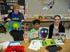​Troy Heritage Trail Elementary School students, here with art teacher Marisa Dion, show some of the favorite pieces they have created so far this school year.