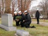 Sea Cadets from Cary laying a wreath at a Navy Veteran's grave.