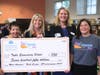 Tuttle Elementary Principal Dr. Patti Folino receives a grant check from Dr. Wendy Katz of The Patterson Foundation, Nicole Light from the Community Foundation and EdExploreSRQ Manager Angela Hartvigsen