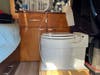 A Laveo portable waterless toilet ready for use inside a campervan. 