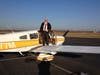 Kevin Baldwin standing on his four-seat Piper Cherokee Warrior.  