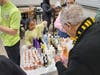 Youth of all ages find joy in helping at We Cancerve projects, including this young volunteer who helped hand out hair care items for kits volunteers also packed.