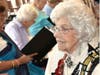 Rita Tracy, in her sequined vest, accompanying the St. Joseph Players  (photo from an event a few years ago in St. Joseph’s Hall)
