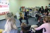 Massachusetts Governor Charlie Baker reads to students at the Professional Center for Childhood Development in Andover