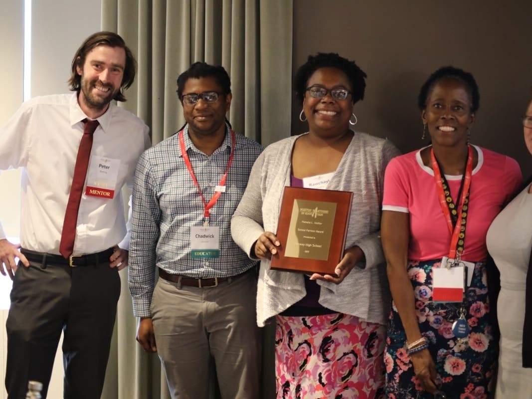 Representatives from Fenway High School accept the School Partner Award from Boston Partners in Education