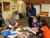 Commissioner Riley joins Milestones’ elementary students in a math-based problem-solving game.