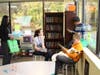 Leldamy Correa, Chief of Staff to the Commissioner, observes a group of middle school students participating in a literacy-themed “escape the room” challenge.