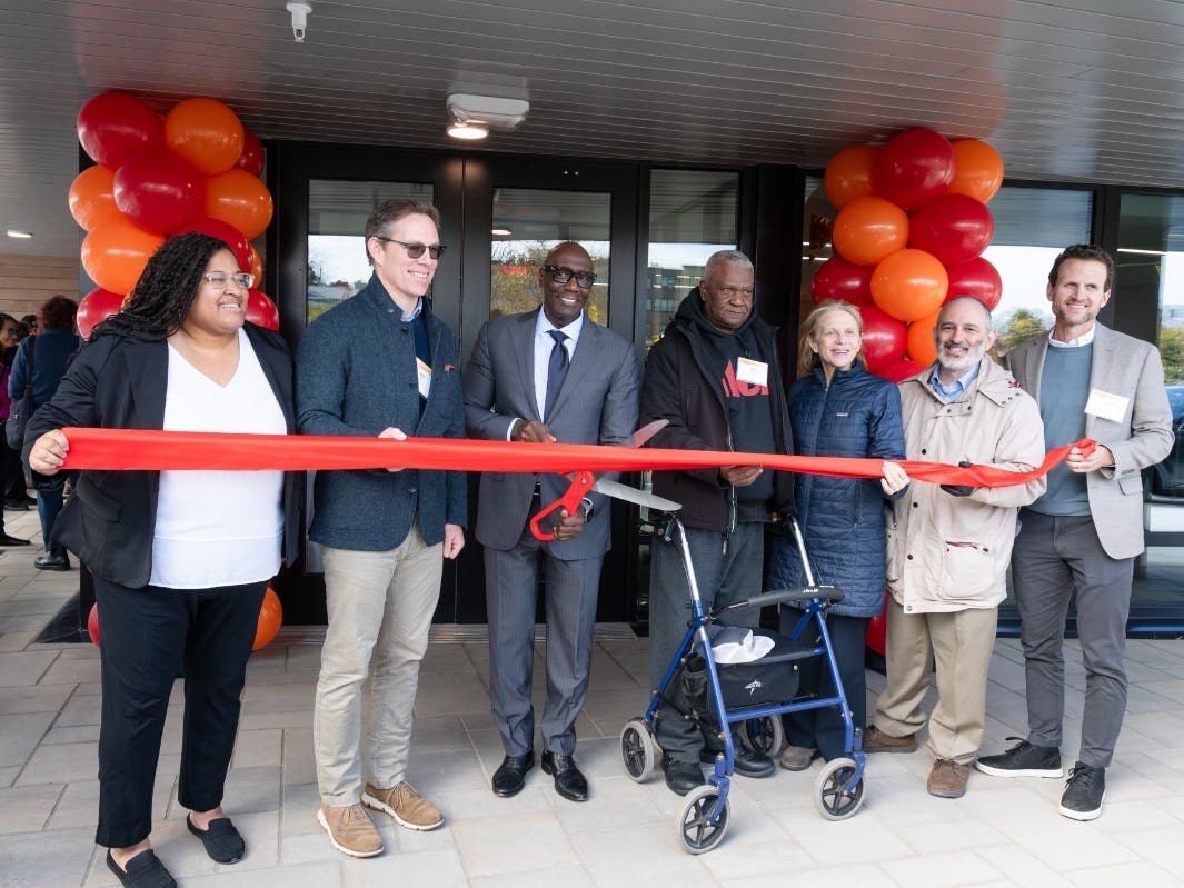 Officials and residents cut the ribbon at the grand opening of 59 Bartlett Station Drive in Boston's Roxbury neighborhood.