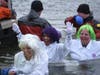 Members of team Alz I Want is a Cure in the water at Subzero Heroes.