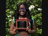 Melodie Cadichon poses with her "Dr. Henry Teoh Award for Outstanding CSTEP Graduating Senior" award.