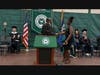 Patrick Cadet (left), associate professor of Biological Sciences and co-director of the Collegiate Science and Technology Entry Program, presents the Teoh Award to Melodie Cadichon during SUNY Old Westbury's annual Convocation to Honor Academic Excellence