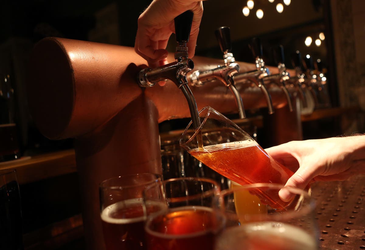 A craft beer being poured.