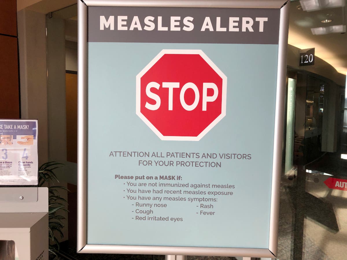  In this file photo, a sign warning patients and visitors of a measles outbreak is shown. 