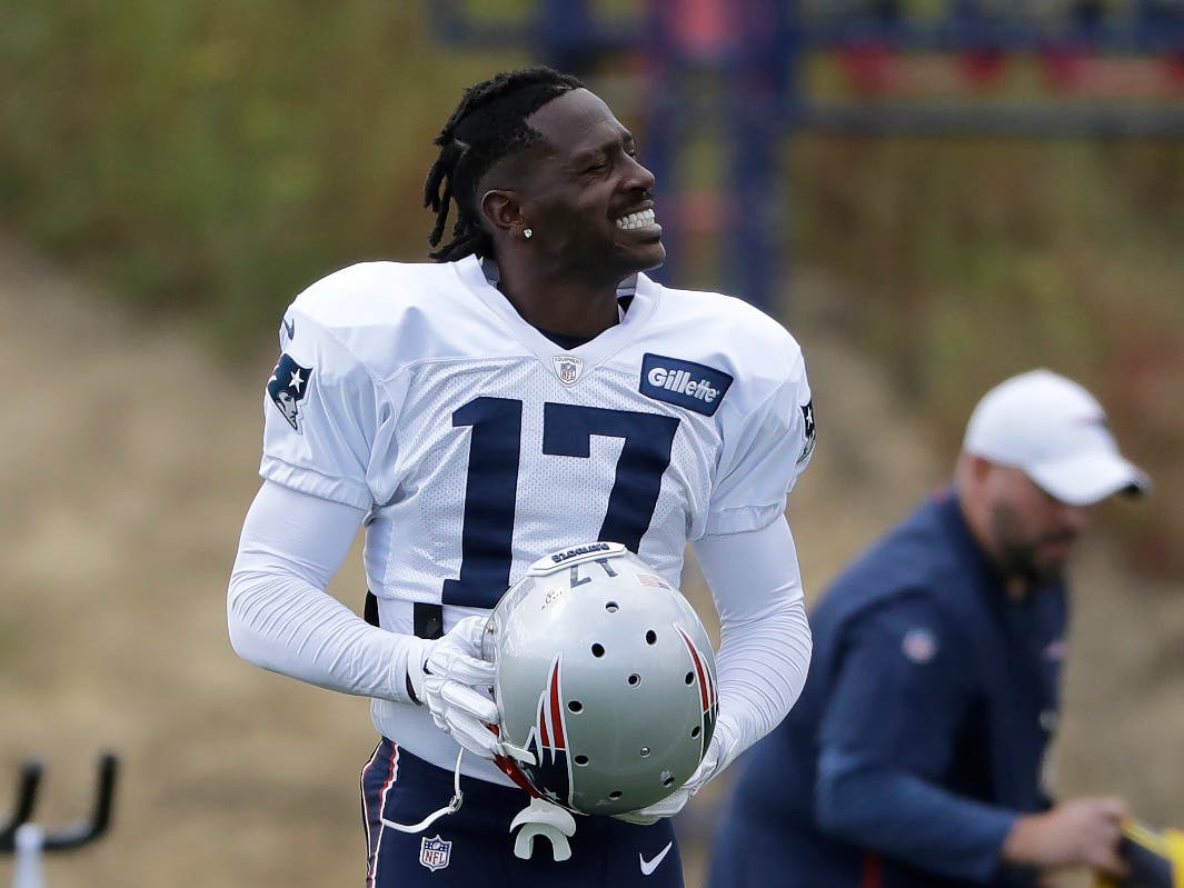 New England Patriots wide receiver Antonio Brown carries his helmet during an NFL football practice, Wednesday, Sept. 18, 2019, in Foxborough, Mass.