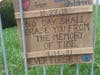 A memorial plaque hung on the fence around the synagogue.